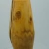 Vase en buis tourne sur 2 axes